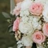 The &quot;Tastefully Timeless&quot; hand-tied bouquet blends elegance and charm, featuring soft pink