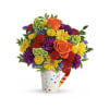 This delightful gift bursts with roses, miniature carnations, button chrysanthemums, and daisies.