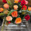 Love Alight contains approximately 12 roses and mixture of greens with some