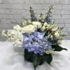 Send your comforting thoughts in this soothing blue and white bouquet. 