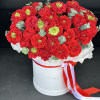 Red monster roses in a flower box.
