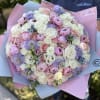 Large bouquet of peonies, roses, spray roses, lisianthus in pink and blue