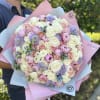 Large bouquet of peonies, roses, spray roses, lisianthus in pink and blue