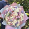Large bouquet of peonies, roses, spray roses, lisianthus in pink and blue