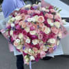 Large bouquet of peonies, roses, spray roses, lisianthus in pink and blue