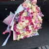 Large bouquet of peonies, roses, spray roses, lisianthus in pink and blue