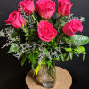 The perfect gift! One dozen elegant long-stemmed roses tastefully arranged with babies&#039;
