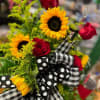 A fresh arrangement to make you smile.  Sunflowers mixed with roses
