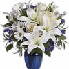 Elegant blue and white floral arrangement with white oriental lilies, daisies, roses