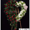 A beautiful open heart arrangement designed with white hydrangeas, green mist and