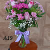 It has purple roses and lavender daisy and other type of flowers