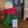 A floral arrangement of our local Folklore &quot;The Flatwoods Green Monster&quot; of