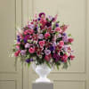 Traditional style sympathy arrangement for the service. Made from roses, lilies, larkspur