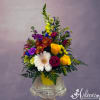Bright and colorful mix of flowers in a metal pot topped with