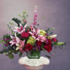 This arrangement expresses earnest respectful love for a sophisticated woman. It is