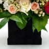 Includes white, and hot pink roses, spray roses, stock, white wax filler