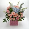 Includes Blue Hydrangeas, white stock, pink roses, pink spray roses, dusty miller