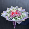 Wrapped rose and alstroemeria bouquet with teddy in middle. 
Can be made