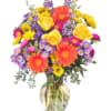 Vase arrangement with gerberas, roses, daisies and other bright blooms.

Copyrighted content provided
