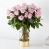 

The picture perfect petals of pink roses gracefully unfold, showcasing their timeless