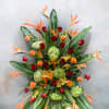 This tropical standing spray is a stunning symbol of your sympathy and