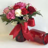 This red hammered jar is the perfect vase for this arrangement. 