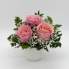 Three pink roses as sweet as your love in a cute white