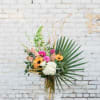 This gorgeous spring arrangement is mixed with beautiful season blooms and its