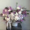 Immerse yourself in the serene elegance of our vase arrangement, adorned with