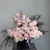 This charming vased arrangement featuring a lovely combination of light pink roses