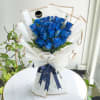 An extraordinary display featuring 24 stems of beautifully  blue roses, nestled