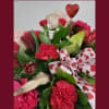 10-12&quot; high martini glass filled with flowers...roses, carnations, alstromeria and beautiful greenery.