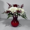 This beautifully simple arrangement includes a fresh hydrangea and red rose in