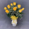 Bright Yellow Long Stem Roses in a Clear Glass Vase.