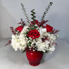 Hydrangea and Rose Vase Arrangement includes multiple hydrangeas and 4 red roses.