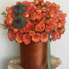 Orange Roses and Spray Roses in a Orange velvet box. 
