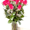 Beautiful hot pink roses with wax flowers. 