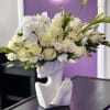 The &quot;Elsa&quot; flower arrangement features elegant white calla lilies, orchids, and roses