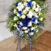 The Serenity Blooms Easel Spray is a graceful and elegant floral arrangement