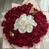 Stunning bouquet of long stem red and white roses wrapped with water