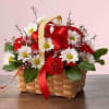 Carnations and spring daisies are arranged in a basket to say I&#039;m