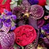 A striking bouquet designed to captivate with its dramatic colors and intricate