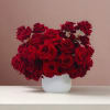 Behold the timeless elegance of our red rose arrangement in a pristine