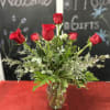 Picture shown with 6 gorgeous red roses and seasonal greens and filler.
Mixed