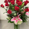 One dozen premium roses, oriental lilies, hydrangeas and a variety of greens.