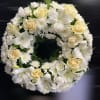 This elegant funeral wreath is a timeless symbol of honor and remembrance.