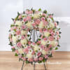 This graceful cremation floral arrangement is a dignified and heartfelt tribute. Designed