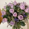 Lavender roses spread throughout a green collection.