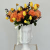 A captivating arrangement nestled within an elegant vase, featuring a delightful mix