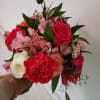 Beautiful cheerful bohemian style bouquet with hot pink standard and garden roses